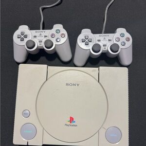Sony PlayStation Console with Dual White Controllers